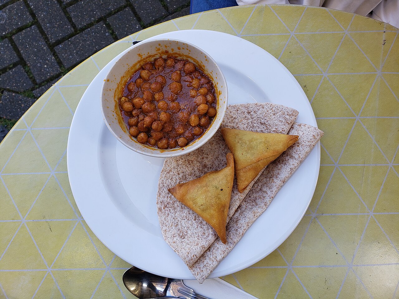 Chana masala served with fried snacks