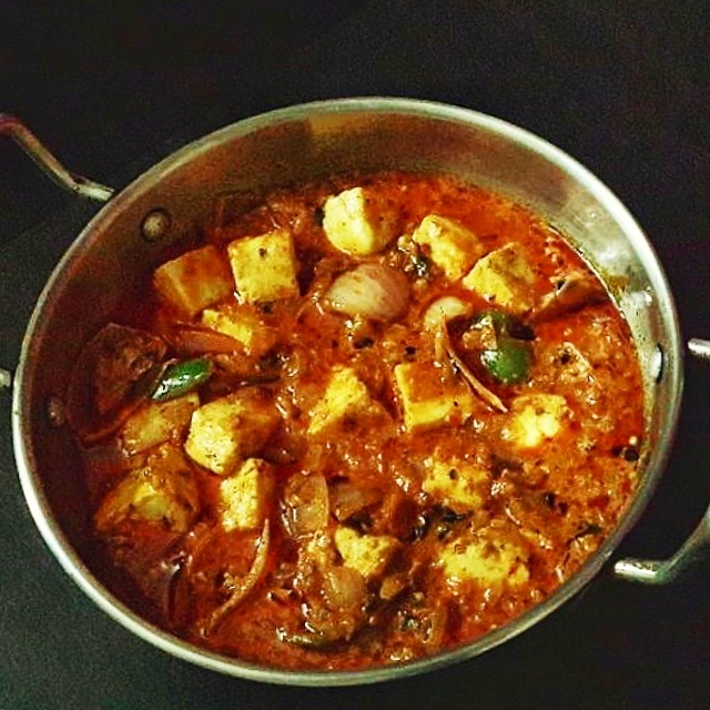 Kadai paneer curry in a steel kadai