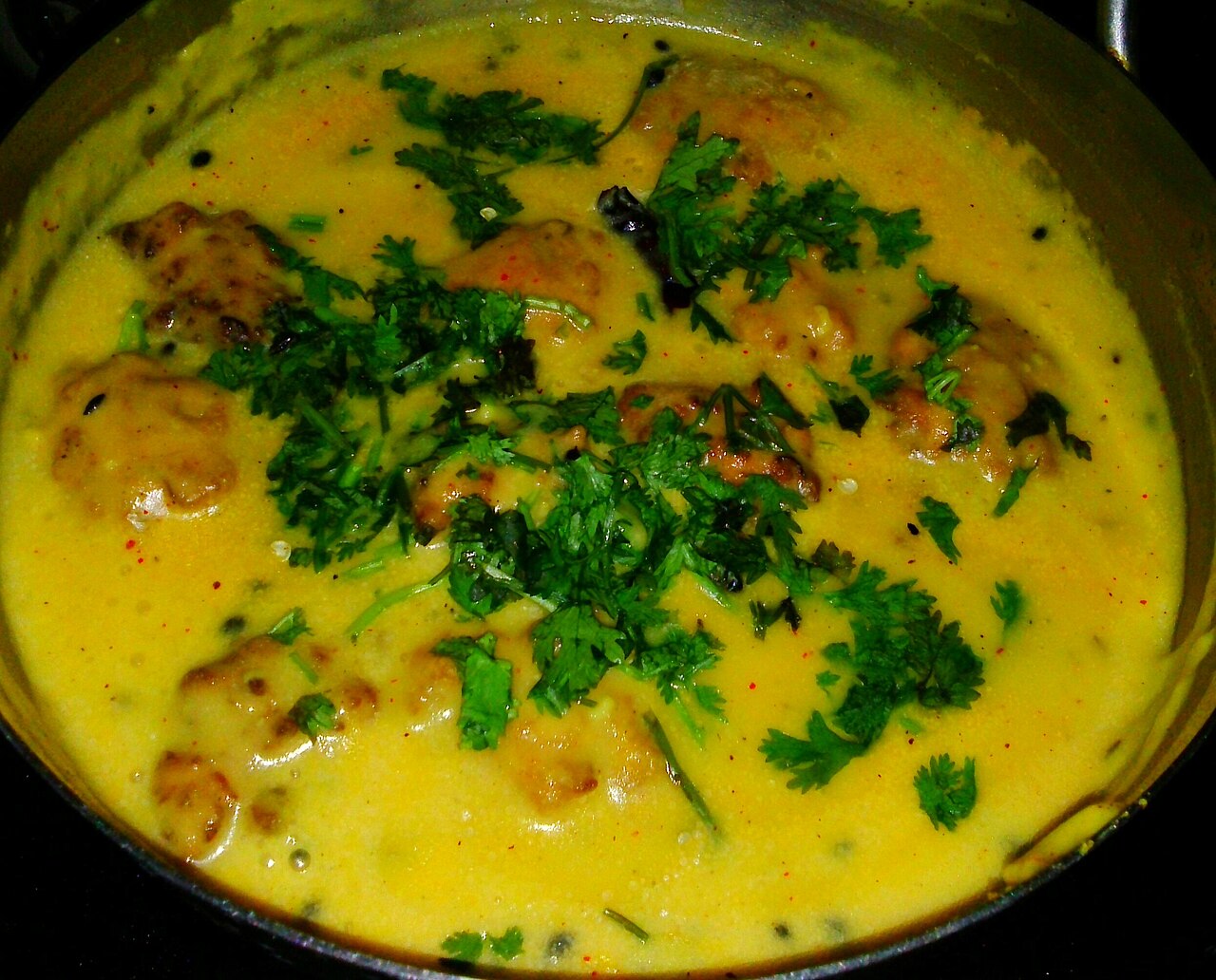 Kadhi pakoda curry with pakoda dumplings